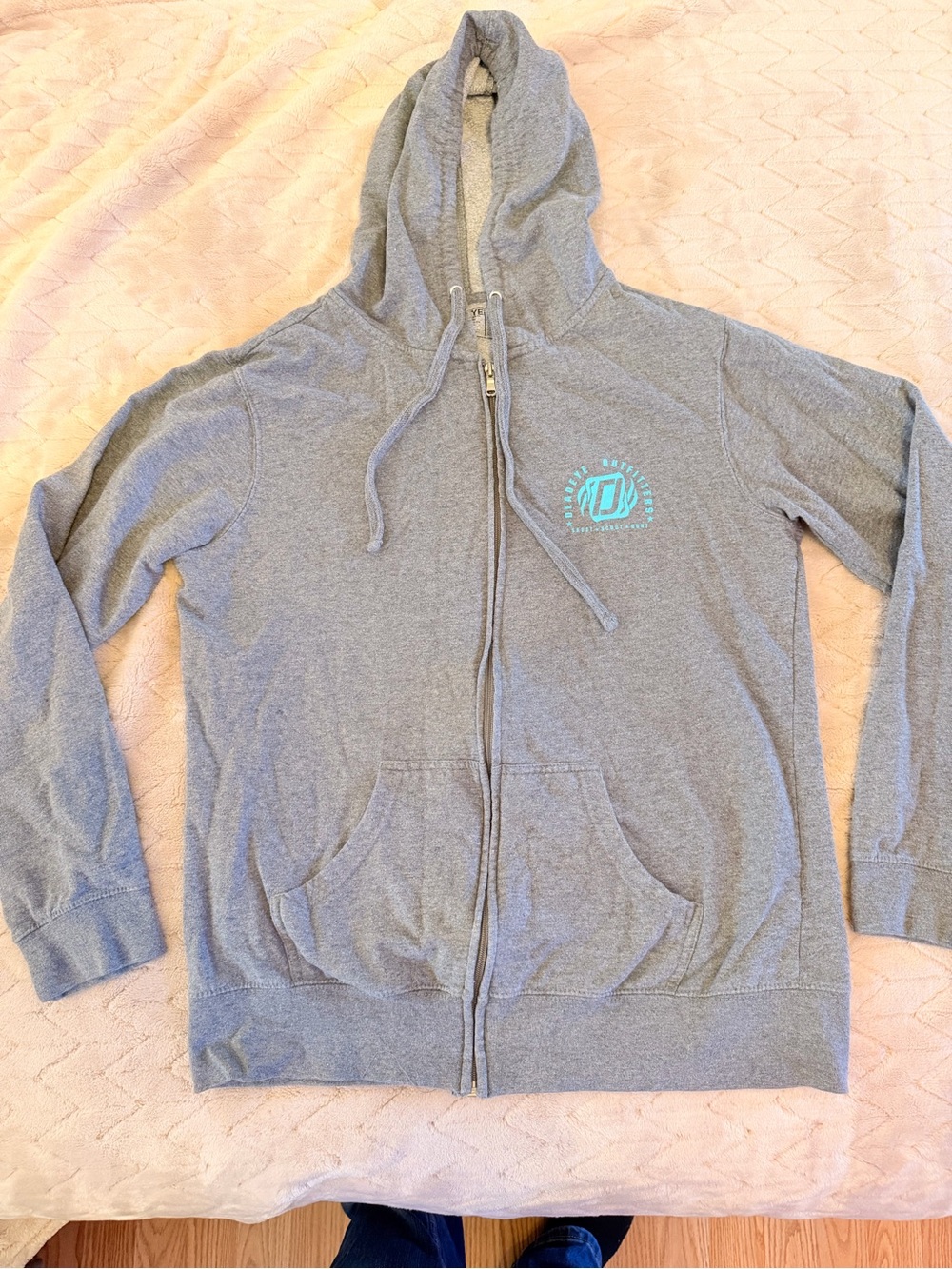 Deadeye Outfitters Woman’s Gray Zip Hoodie with Teal Logo